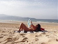 ExpressiaGirl with big tits sunbathes and walks naked on the beach