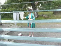 Naked in public. Neighbor saw pregnant neighbor in window who was drying clothes in yard without bra and panties. Nudist