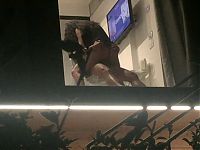 Voyeur caught horny couple fucking through hotel window